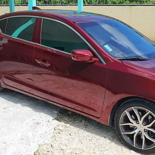 Red sedan with tinted windows