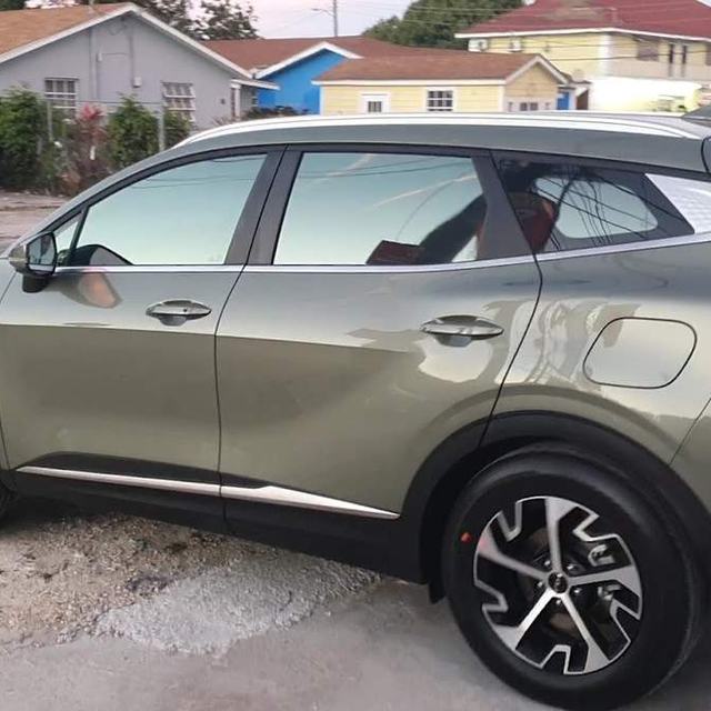 Olive SUV with tinted windows